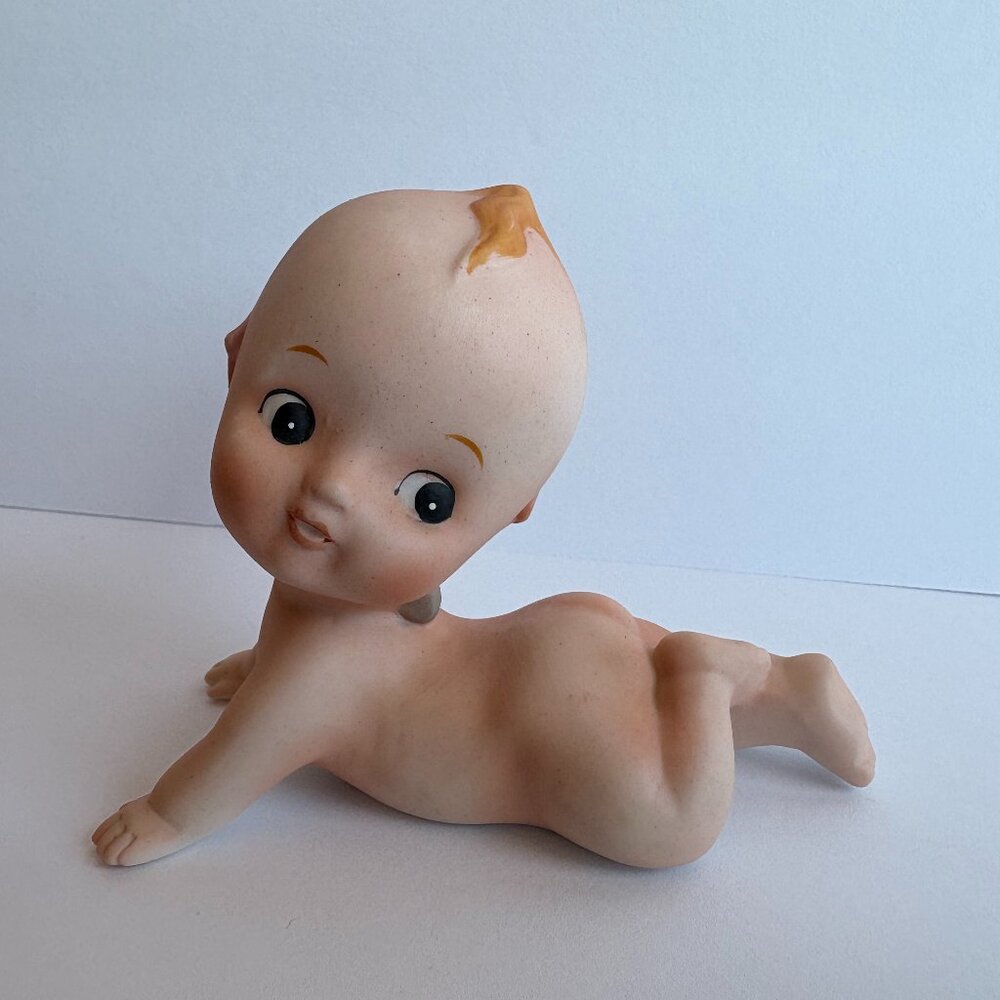 Vintage Porcelain crawling baby doll figurine